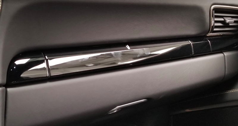 Illustration for article titled The Needlessly Complicated Cupholders in the Porsche 911 Are Awesome